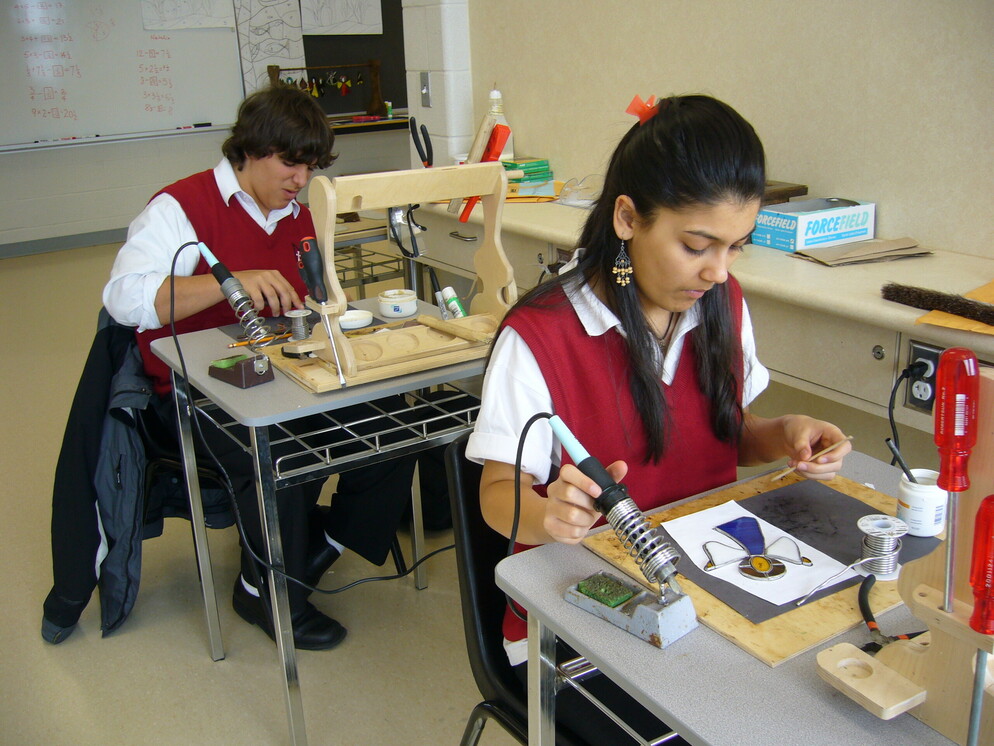 people soldering