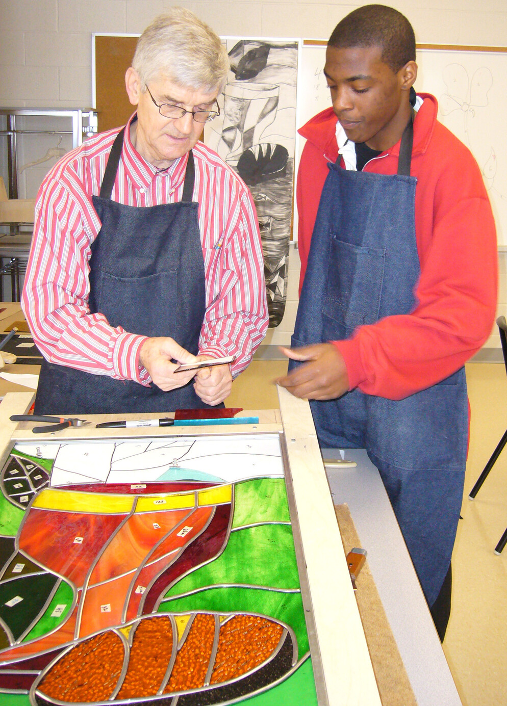 People assembling pieces of the panel
